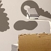 Abb. An die Wand projizierte Silhouetten von Gegenständen